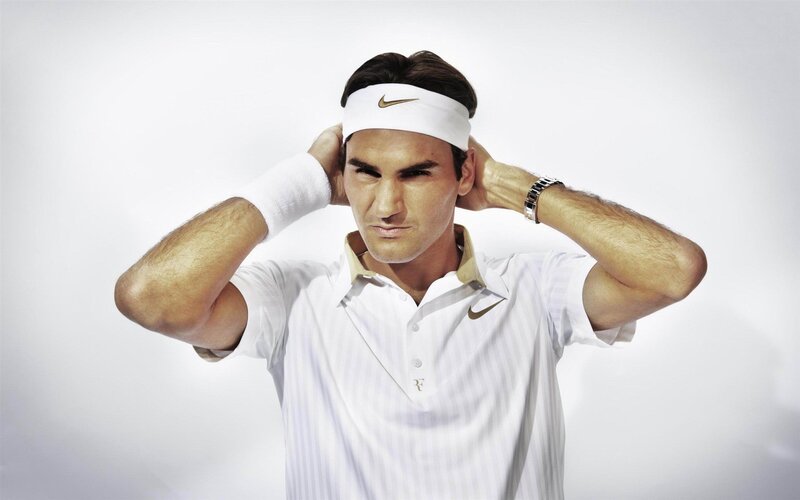 Roger Federer adjusting headband