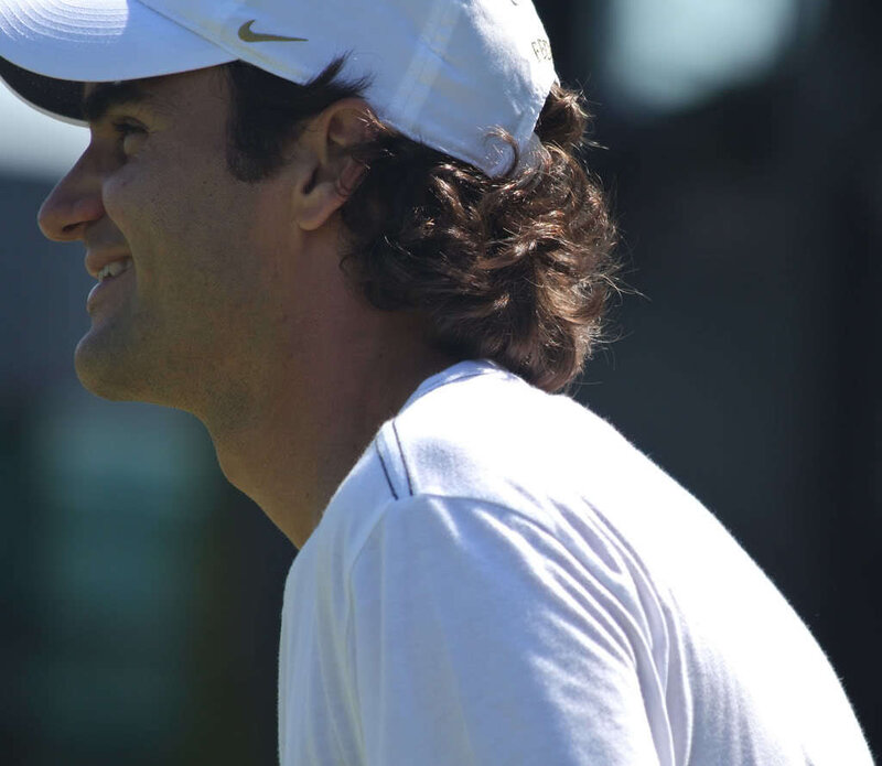 Roger Federer smiling on court