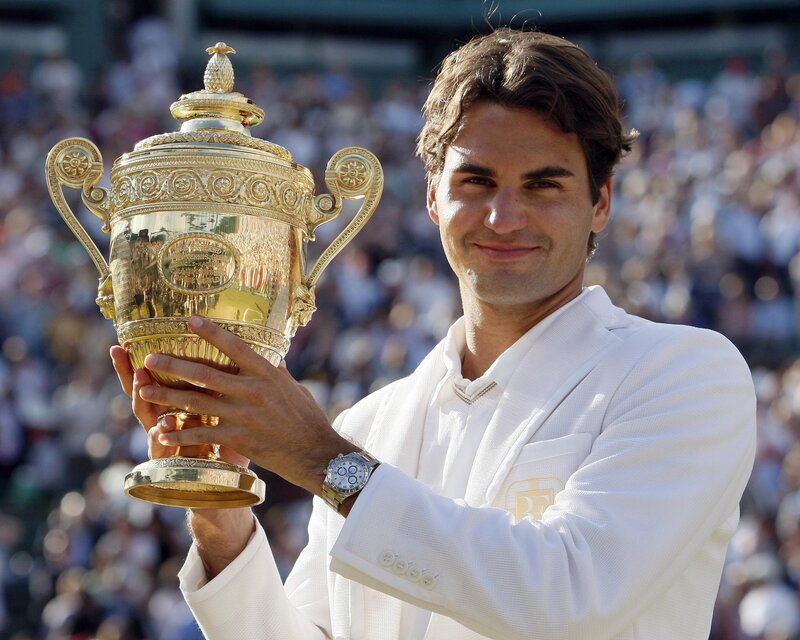 Roger Federer with Wimbledon trophy
