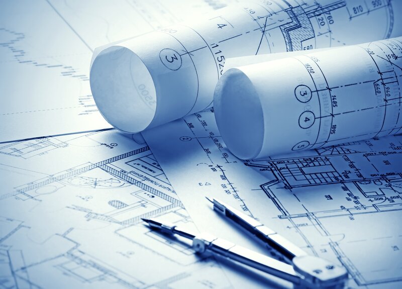 Rolled Blueprints on Table