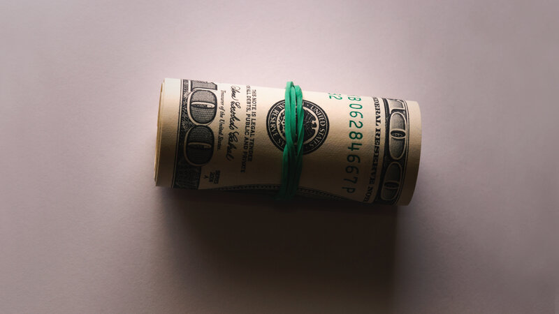 Rolled Hundred-dollar Bills — White