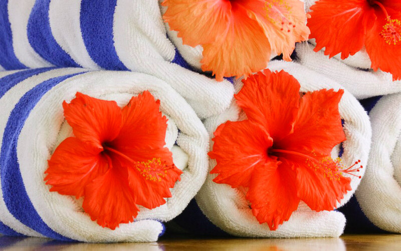 Rolled Towels with Hibiscus Flowers