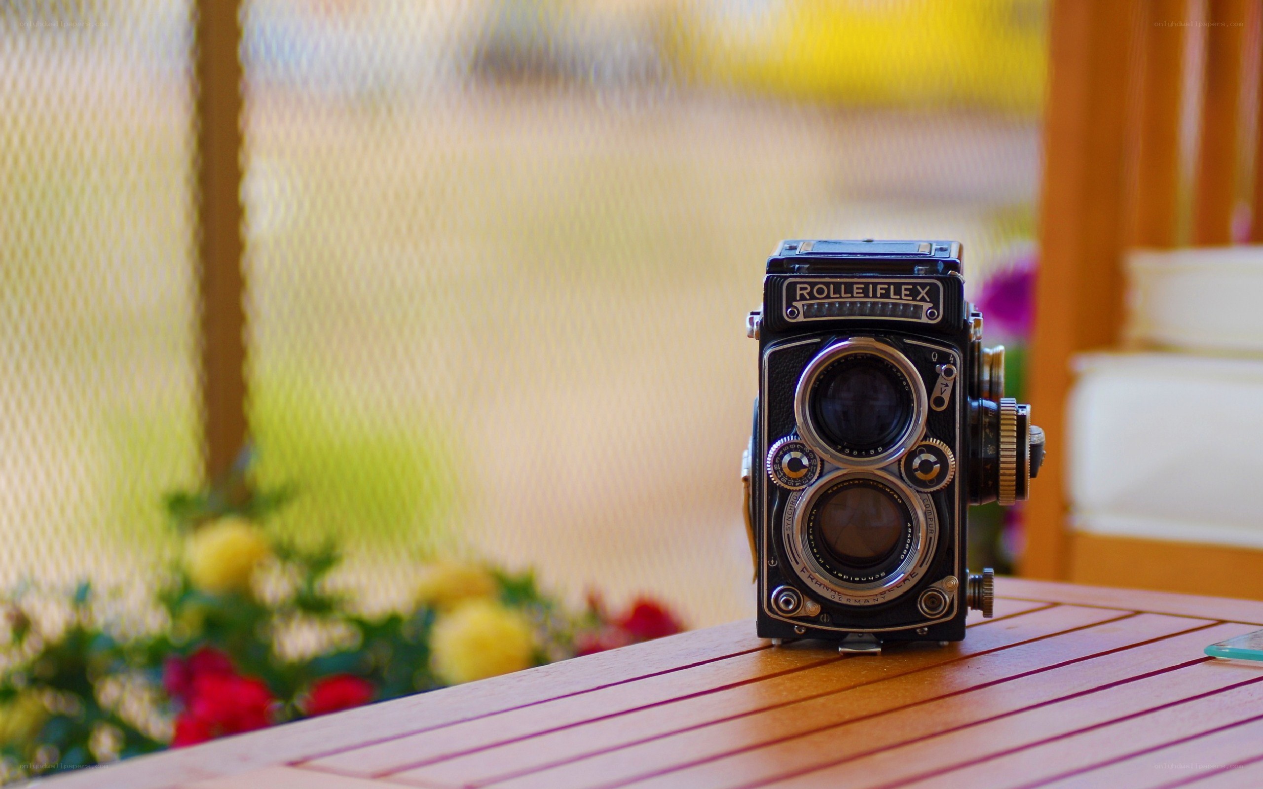 Rolleiflex camera on wooden table