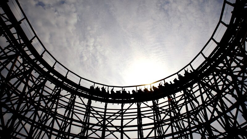Roller coaster loop against sky