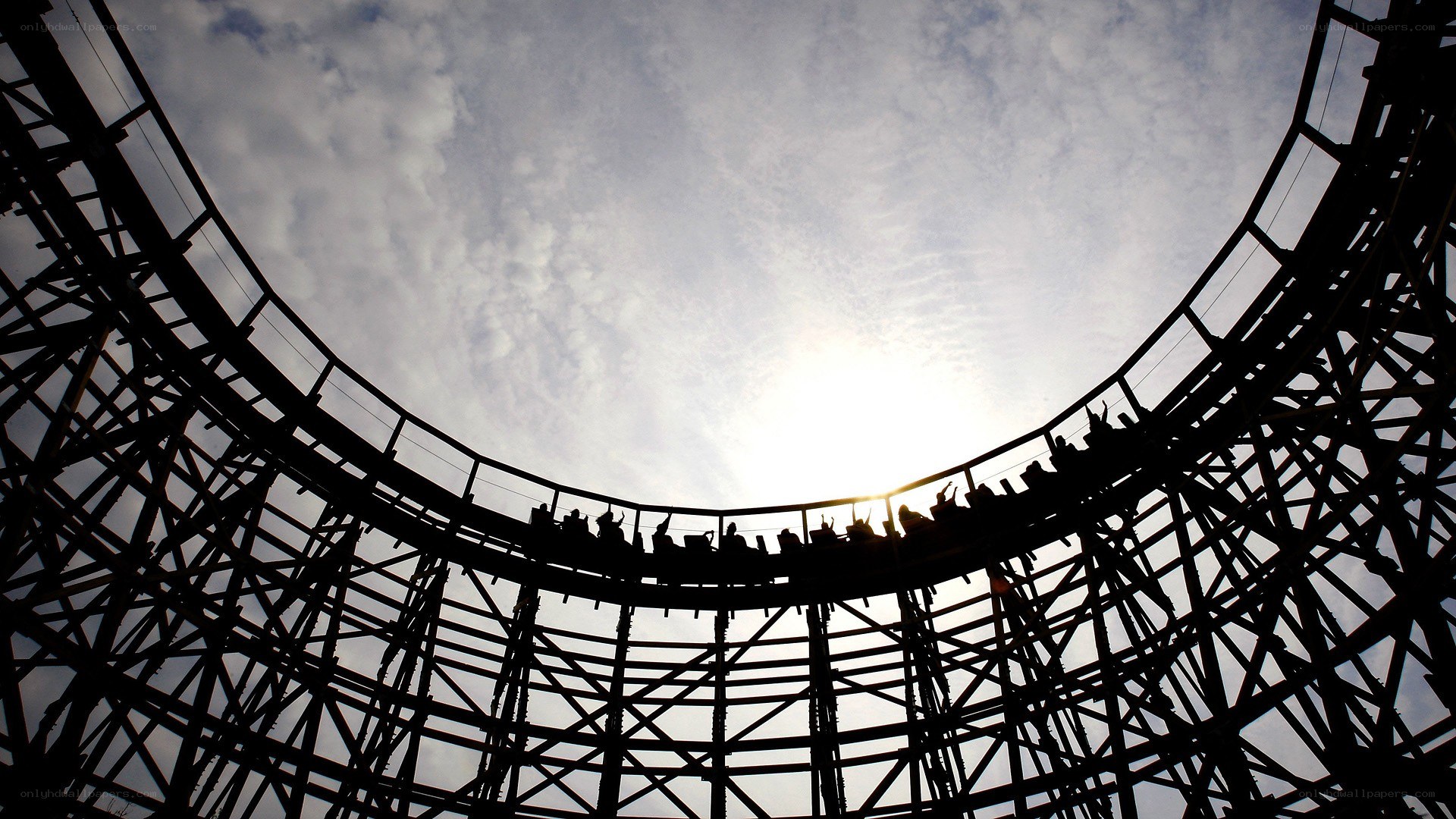 Roller coaster loop against sky