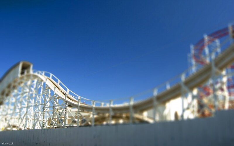 roller coaster under blue sky