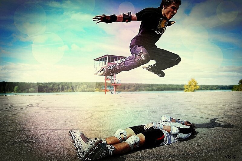 Roller skater jumping over another