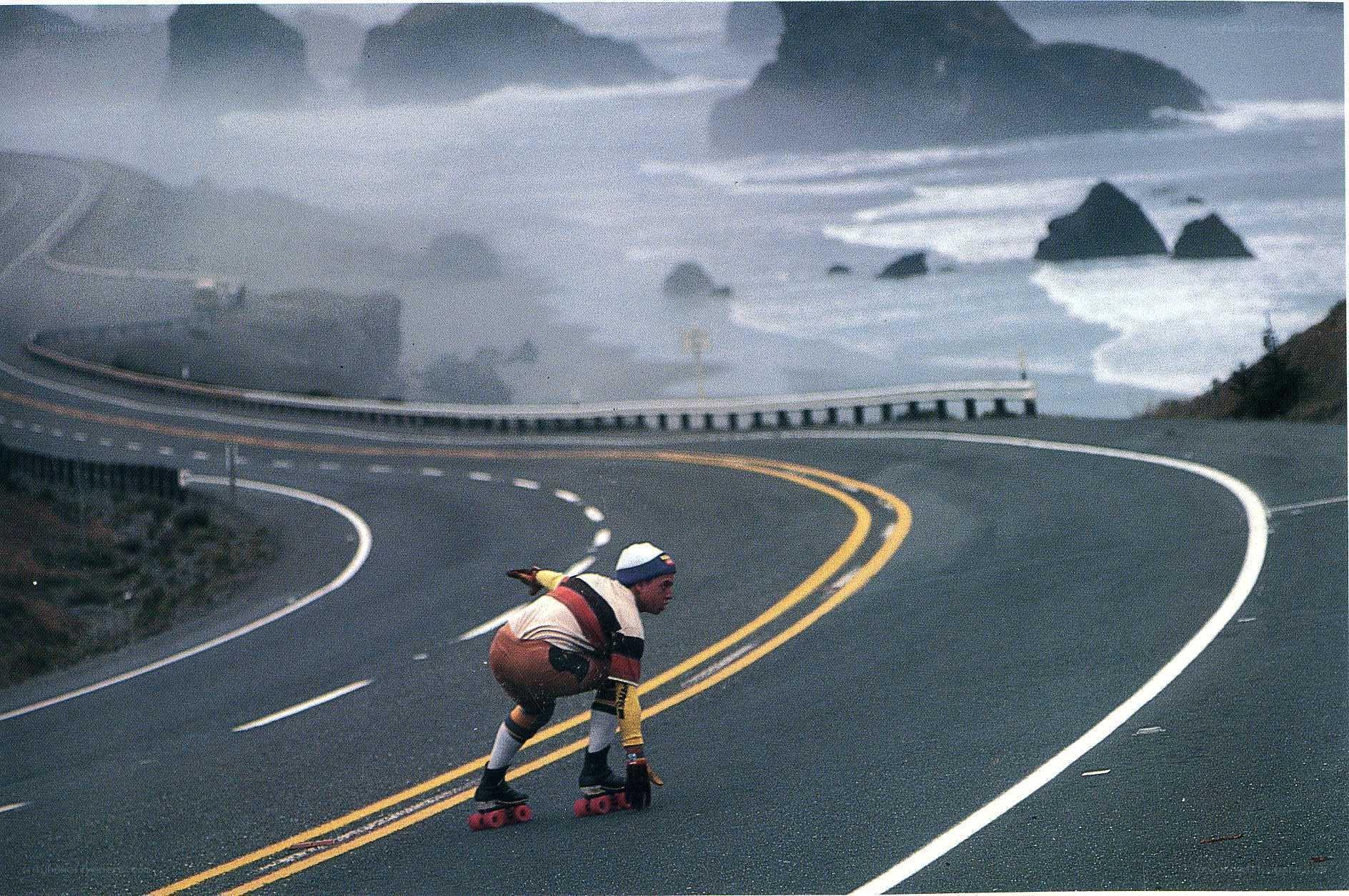Roller skater on coastal road