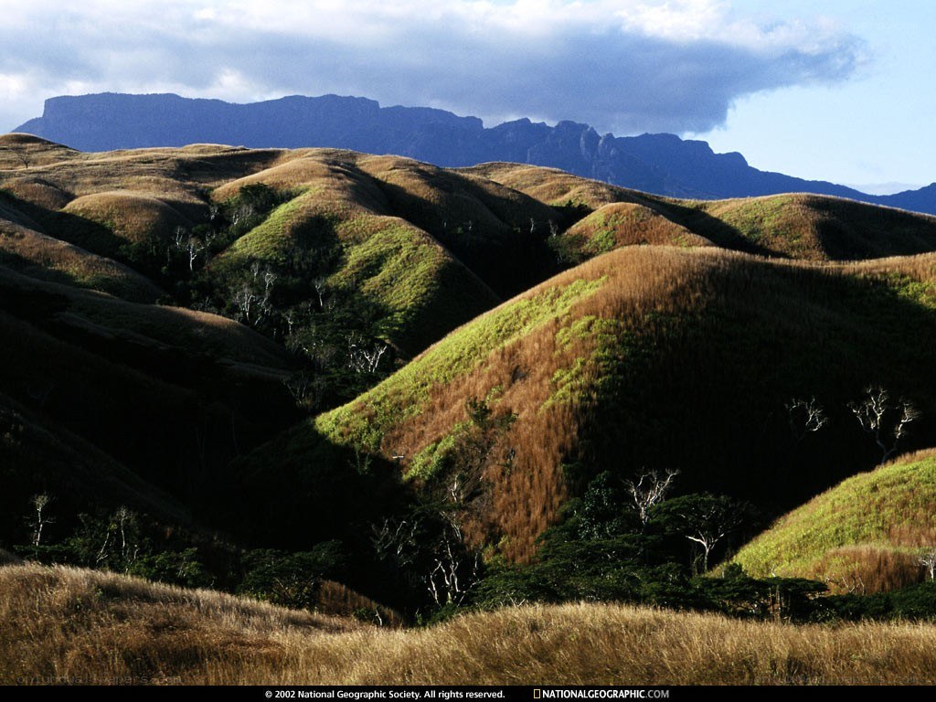 Rolling hills and distant mountains