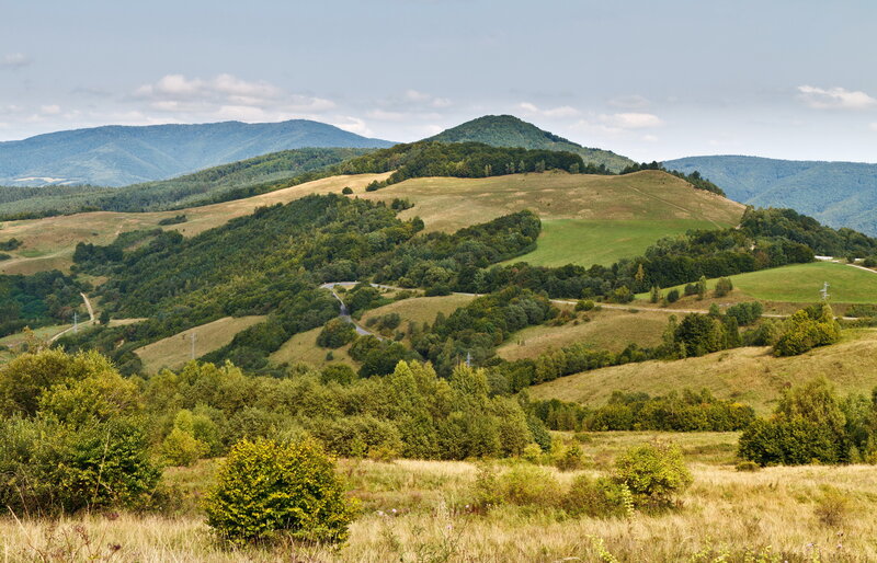 Rolling hills and distant mountains