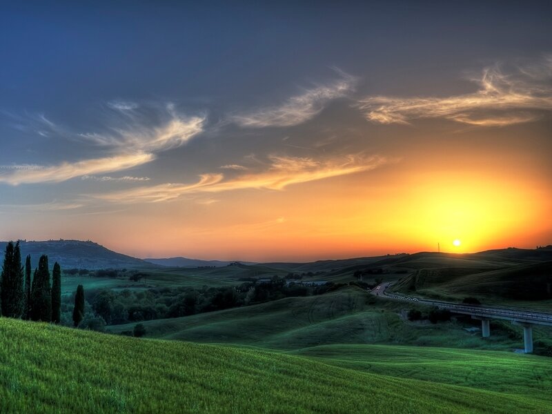 Rolling Hills at Sunset — Green, Serene, Photograph, Sun, Road, Bridge, Trees, Orange, Blue