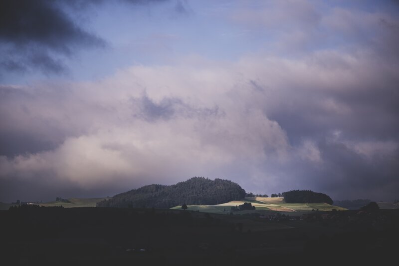 Rolling Hills under Clouds — Blue