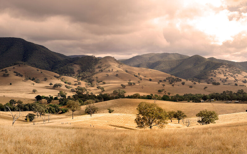 Rolling hills under cloudy sky