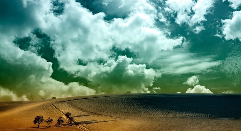 Rolling Hills under Cloudy Sky — Green