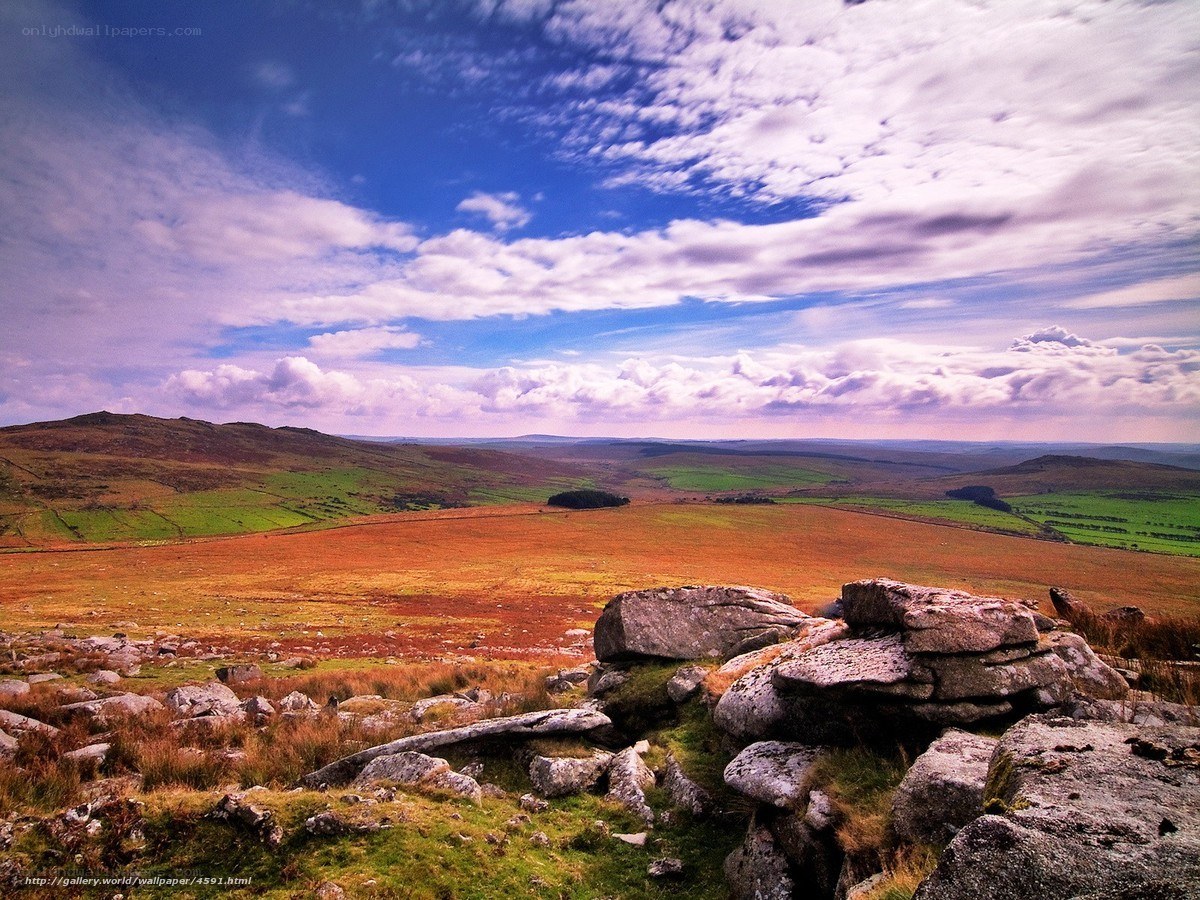Rolling hills under cloudy sky