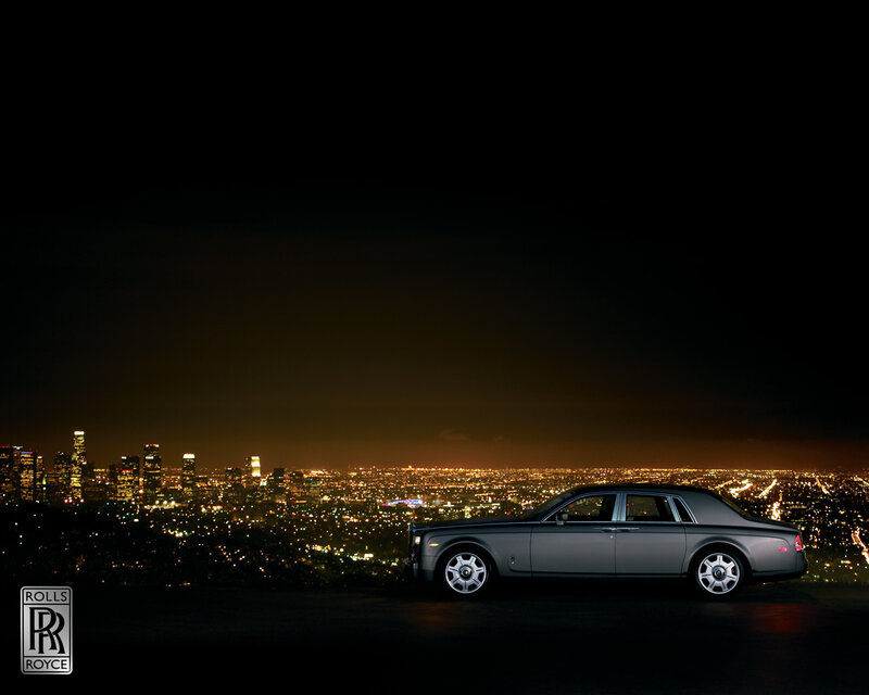 Rolls-Royce at night with city view