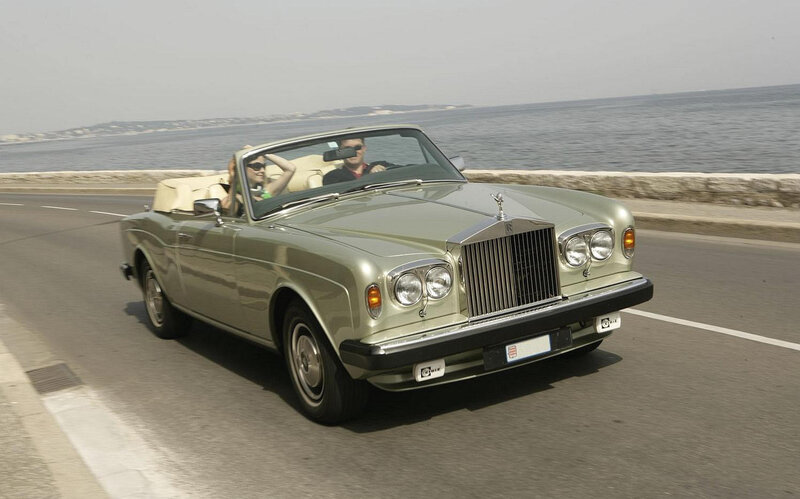 Rolls-Royce convertible on coastal road