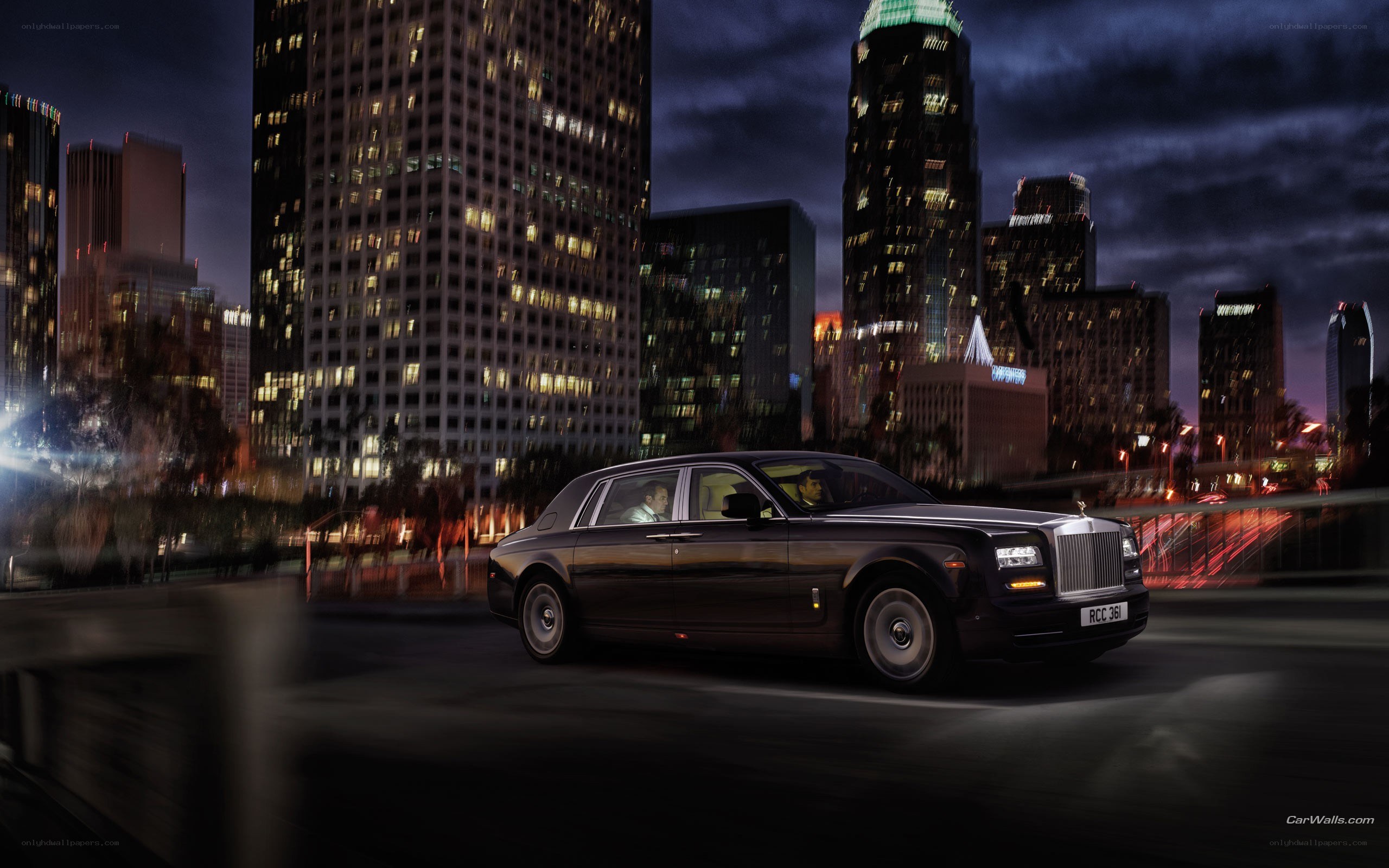 Rolls-Royce in city at night