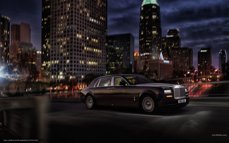 Rolls-Royce in city at night