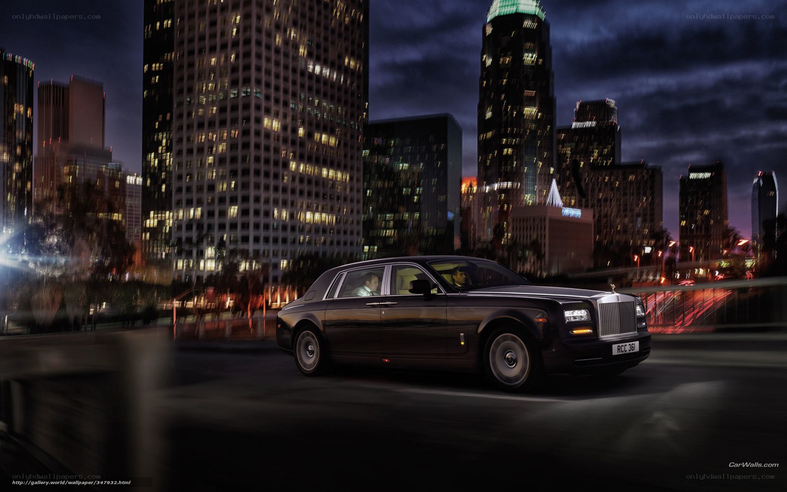 Rolls-Royce in city at night