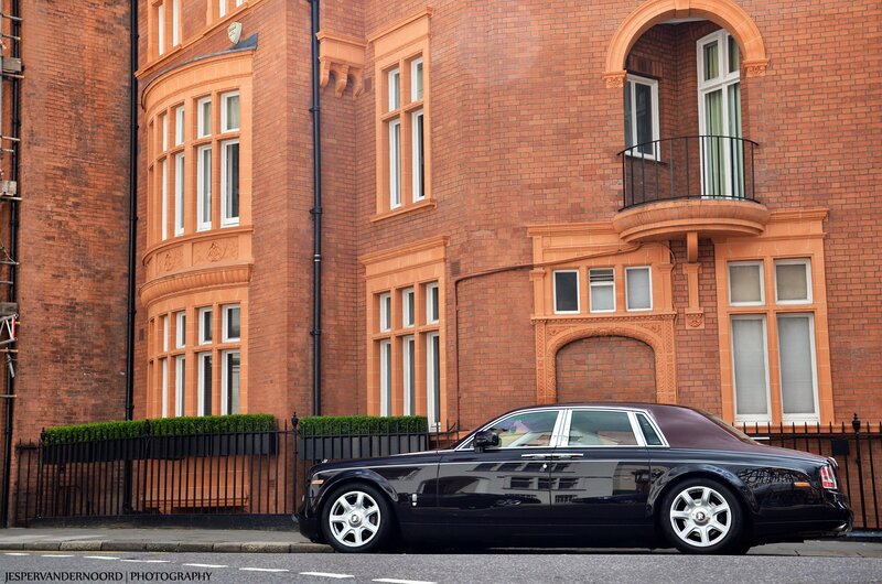 Rolls-Royce in front of brick building