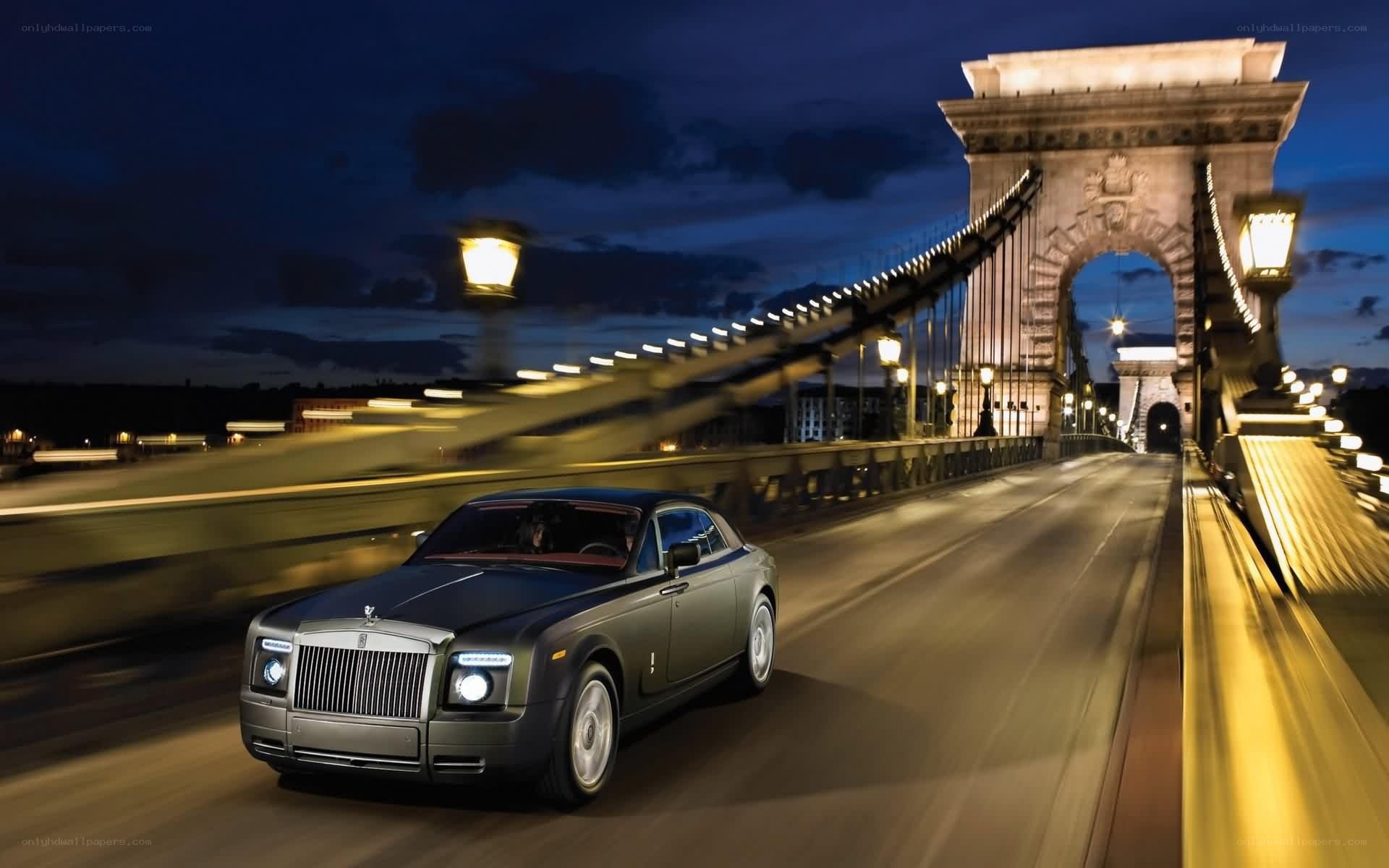 Rolls-Royce on a bridge at night