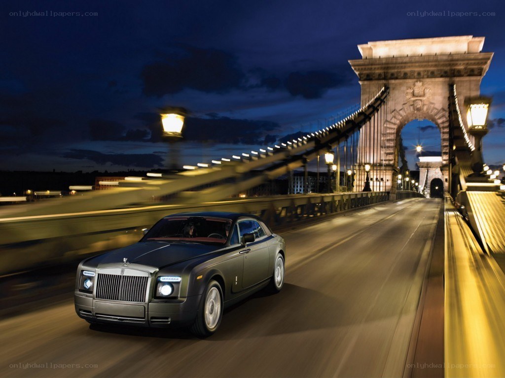 Rolls-Royce on a bridge at night