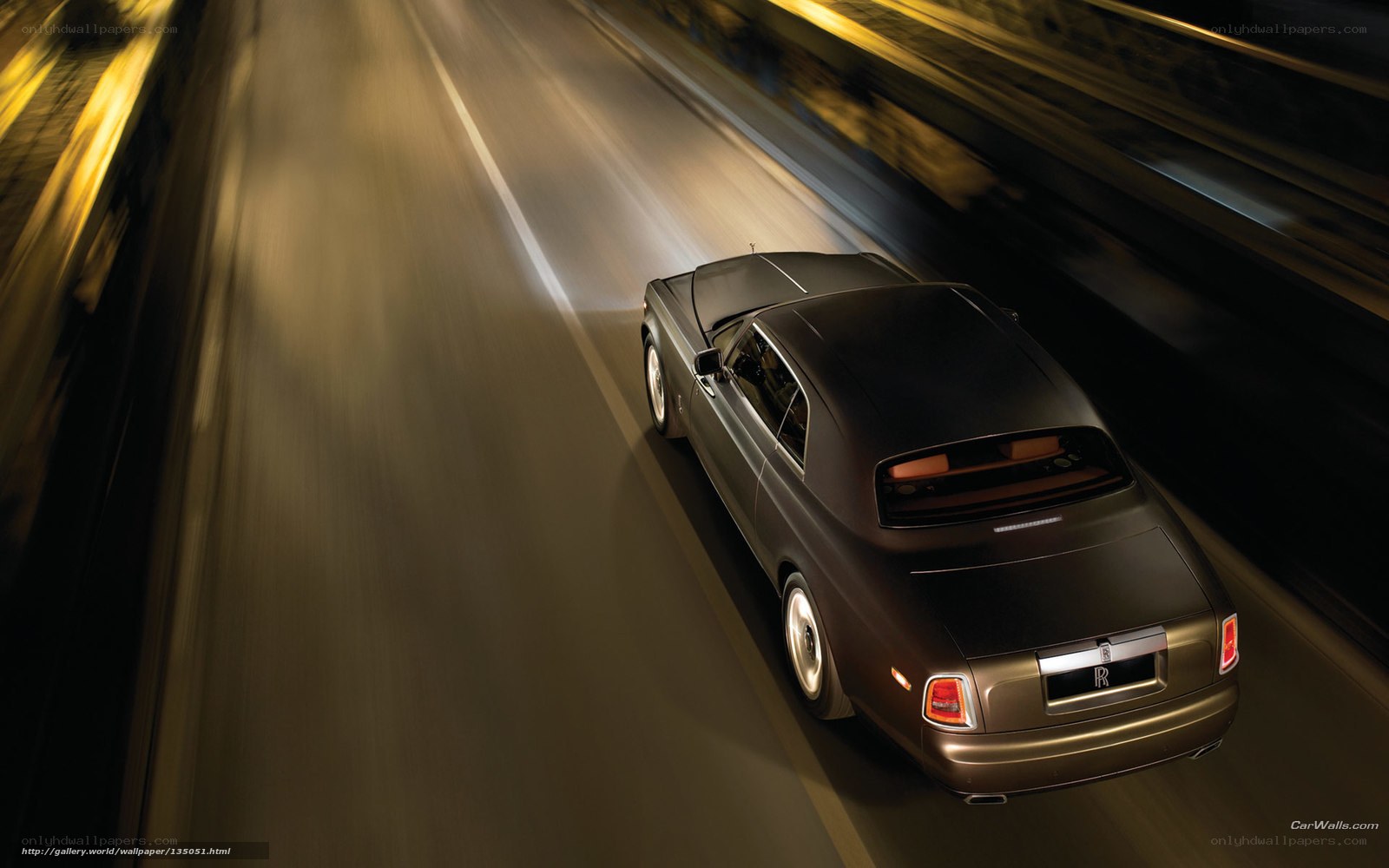 Rolls-Royce on a highway at night