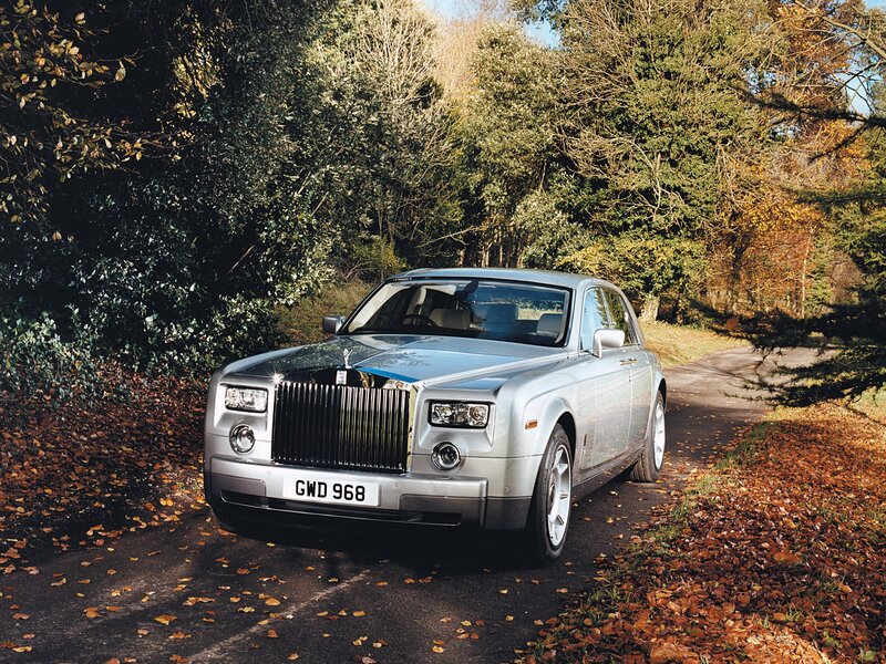 Rolls-Royce on a leafy road