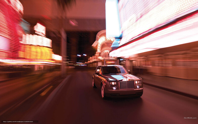 Rolls-Royce on a neon-lit street