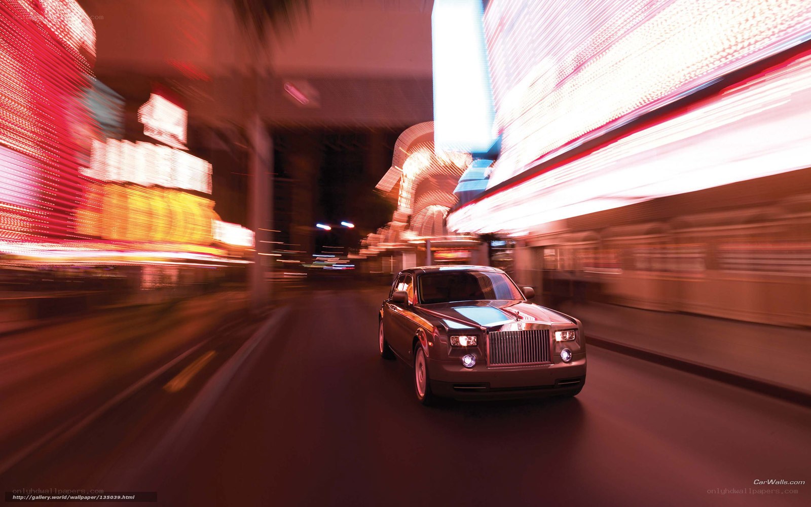 Rolls-Royce on a neon-lit street