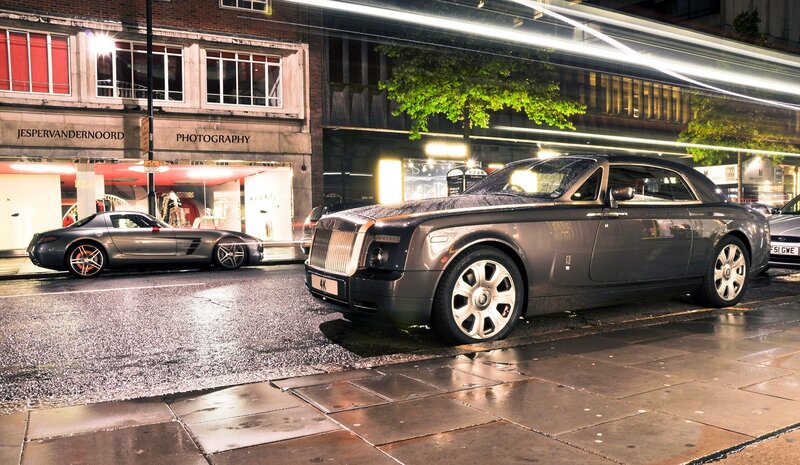 Rolls-Royce on wet city street