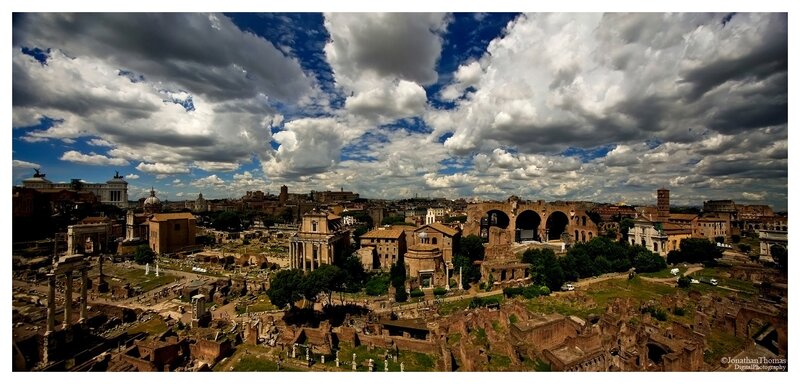 Roman Forum ruins under cloudy sky