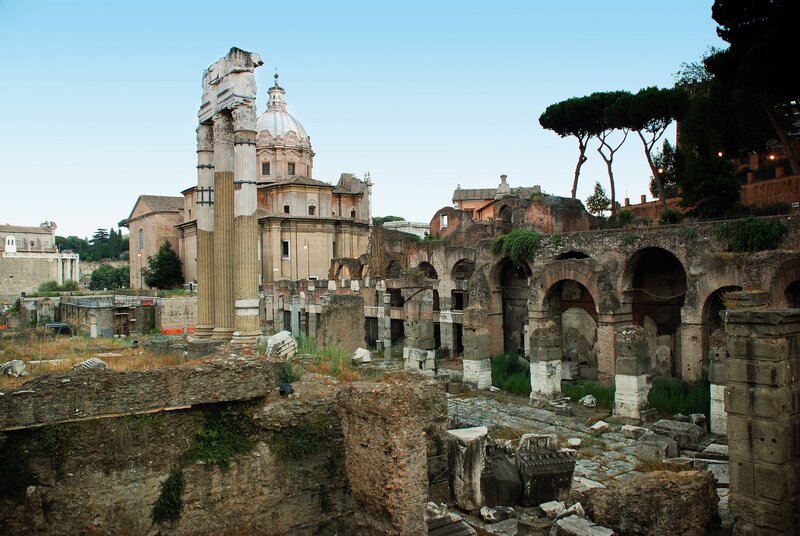 Roman ruins with church in background
