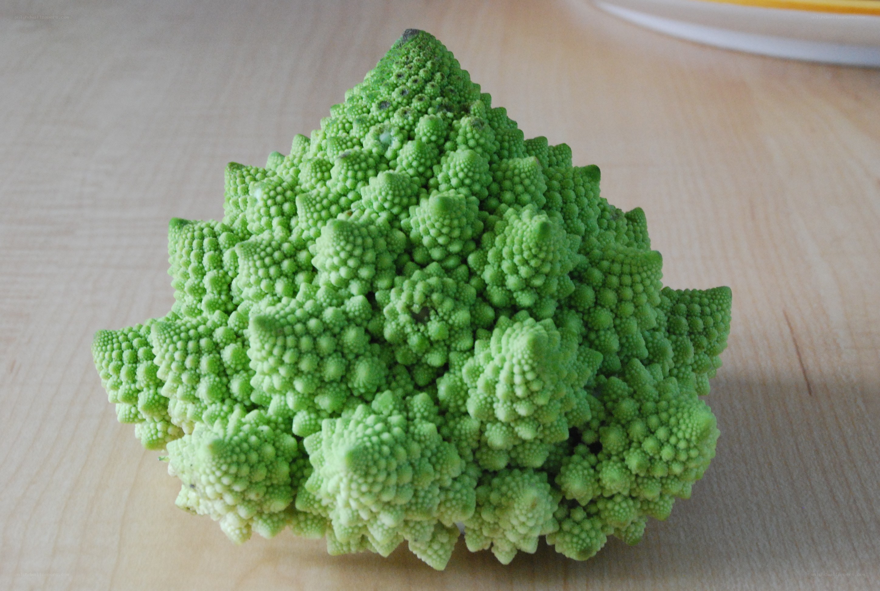 Romanesco broccoli on wooden surface