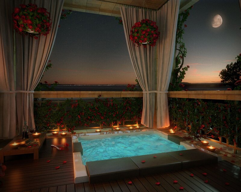 Romantic balcony hot tub at night