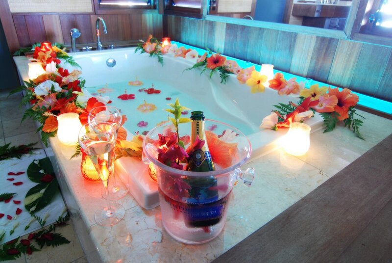 Romantic bath with flowers and champagne