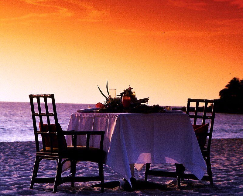 Romantic beach dinner at sunset