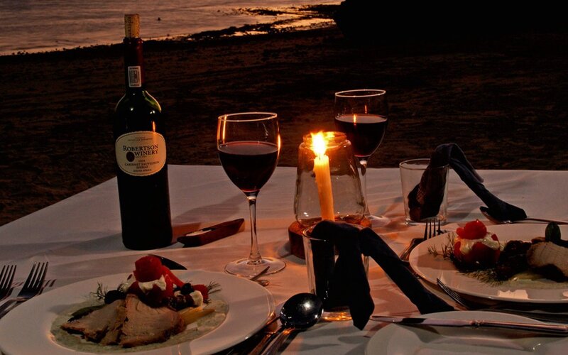 Romantic beach dinner at sunset