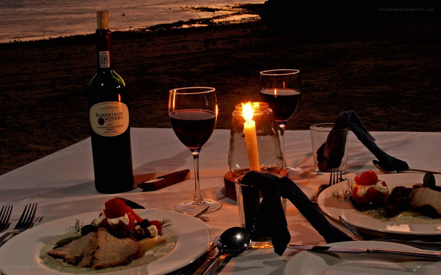 Romantic beach dinner at sunset