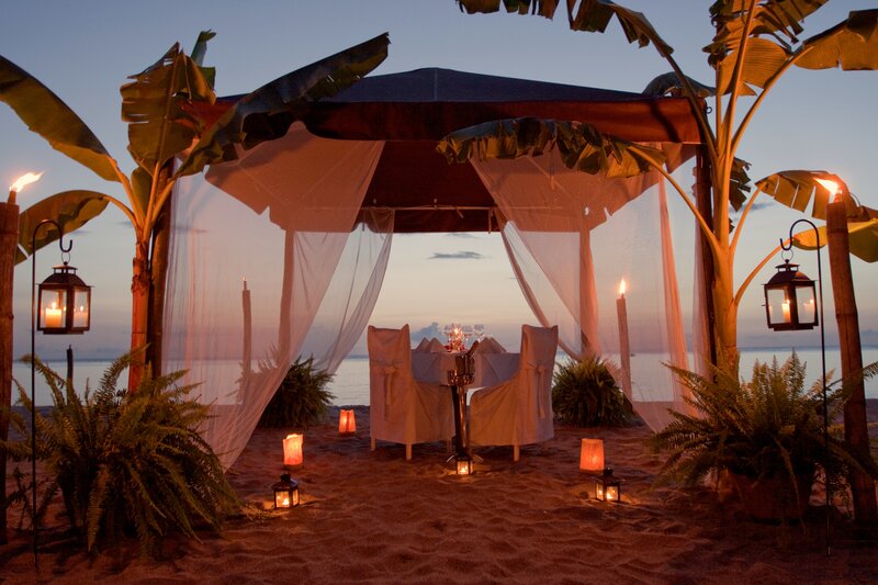 Romantic Beach Dinner Setup — Orange, Serene