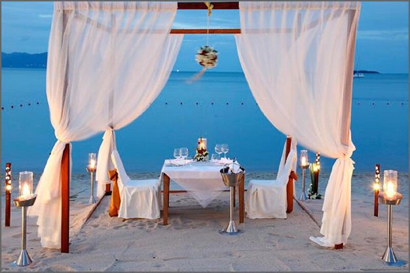 Romantic Beach Dinner Setup — White, Serene, Sunset