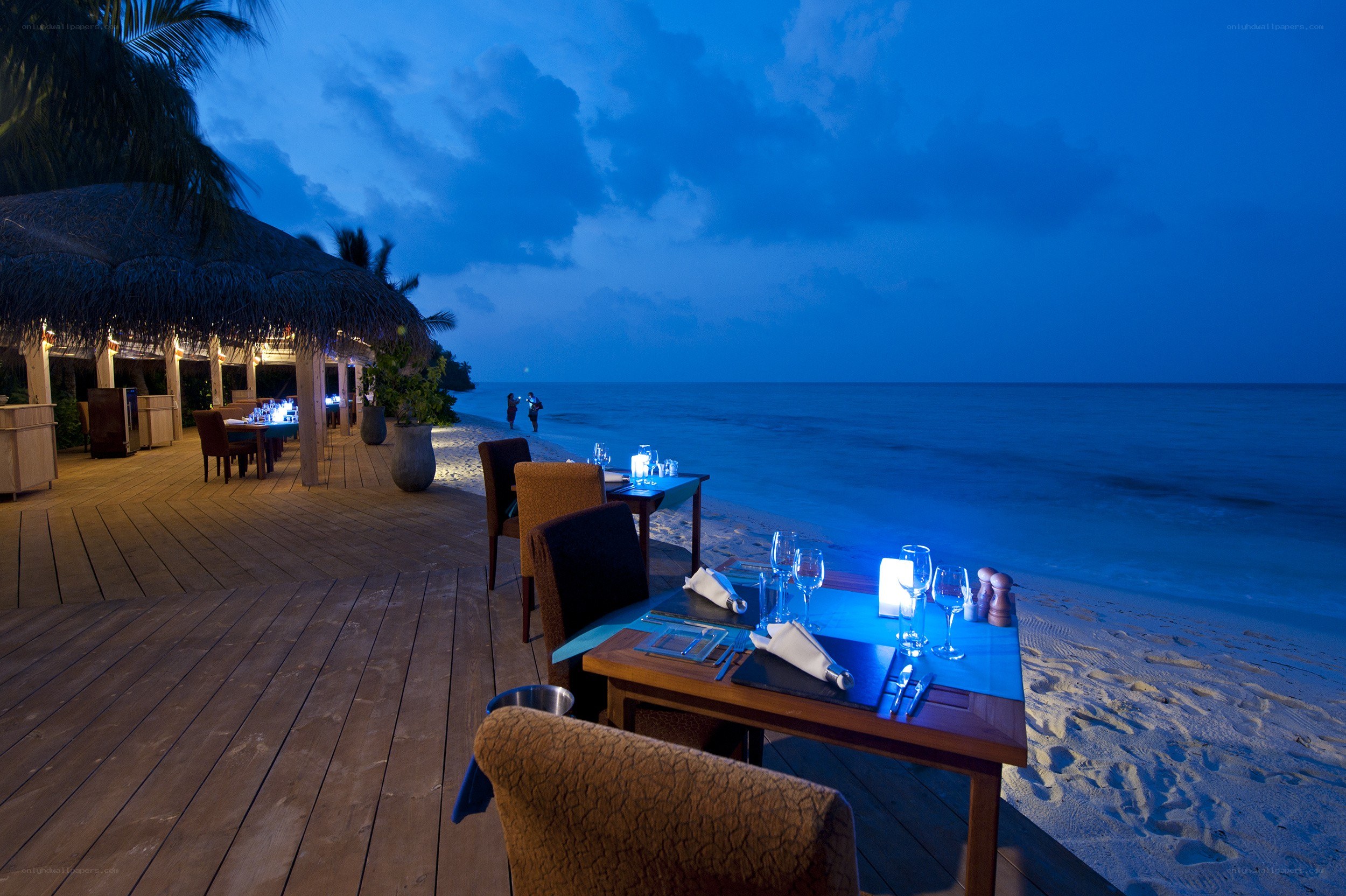 Romantic beachside dinner at dusk