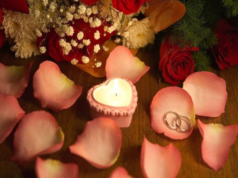 Romantic candle and rings