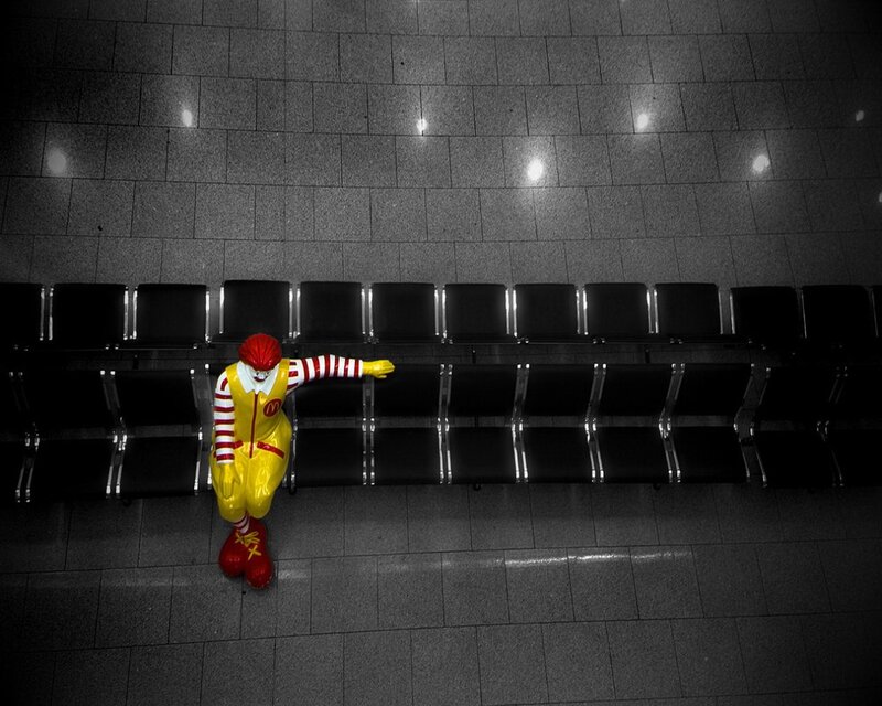 Ronald McDonald statue in empty terminal