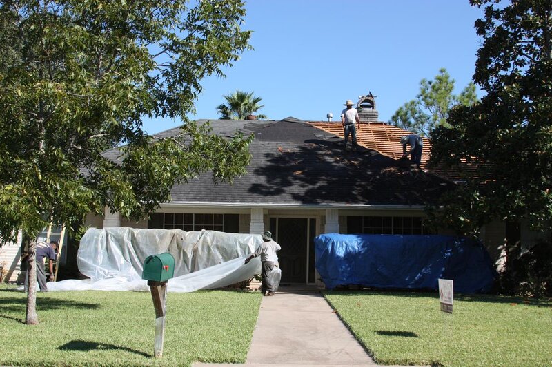 Roofers Working on House