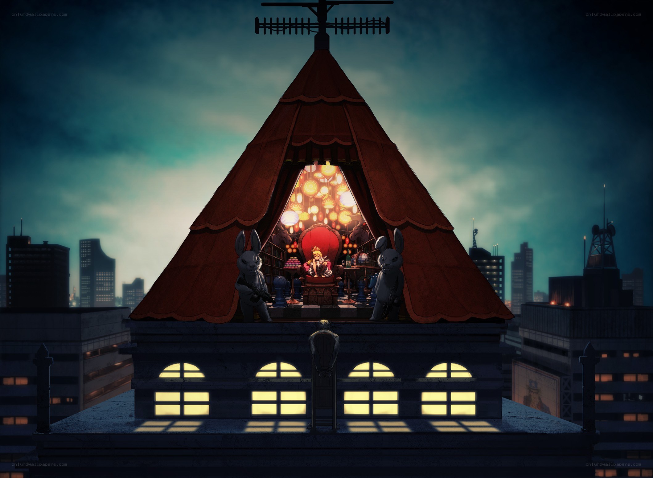 Rooftop puppet theater at night