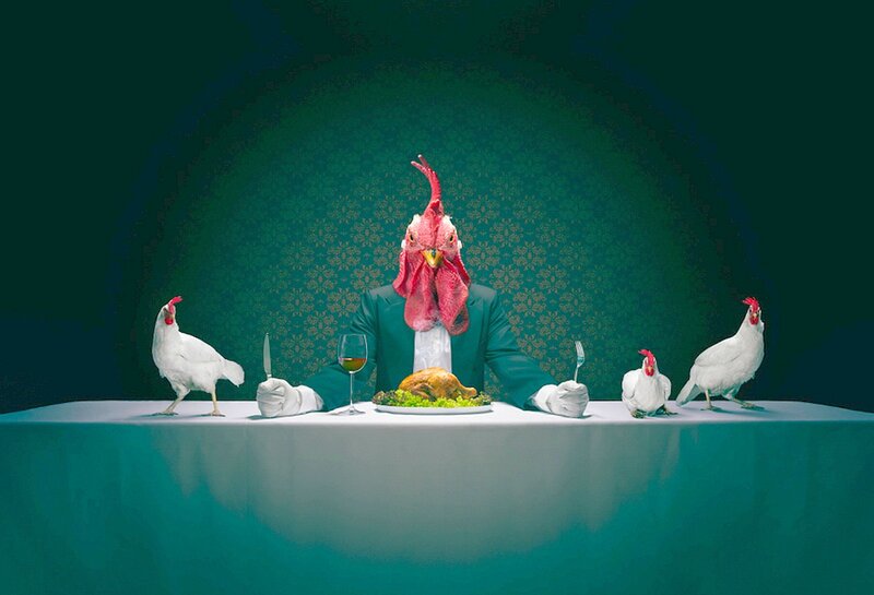 Rooster-headed Person at Table