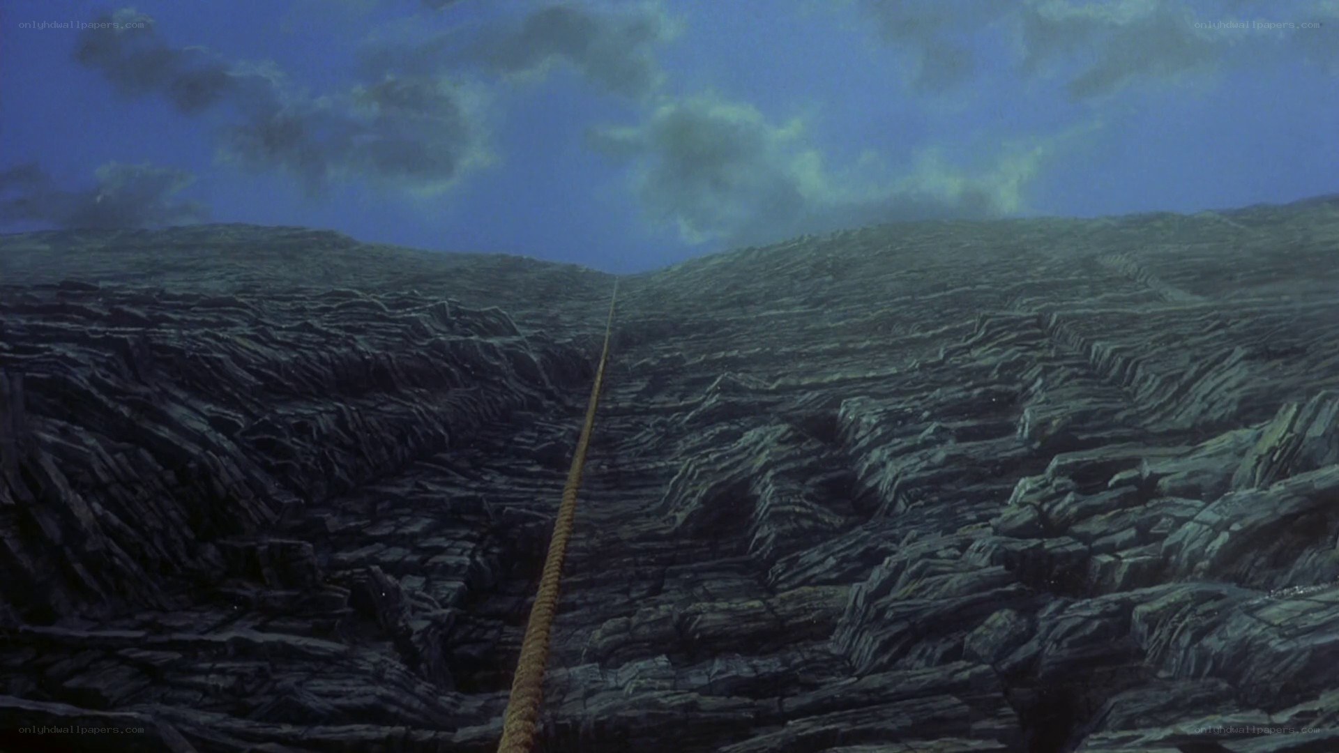 Rope on rocky cliff