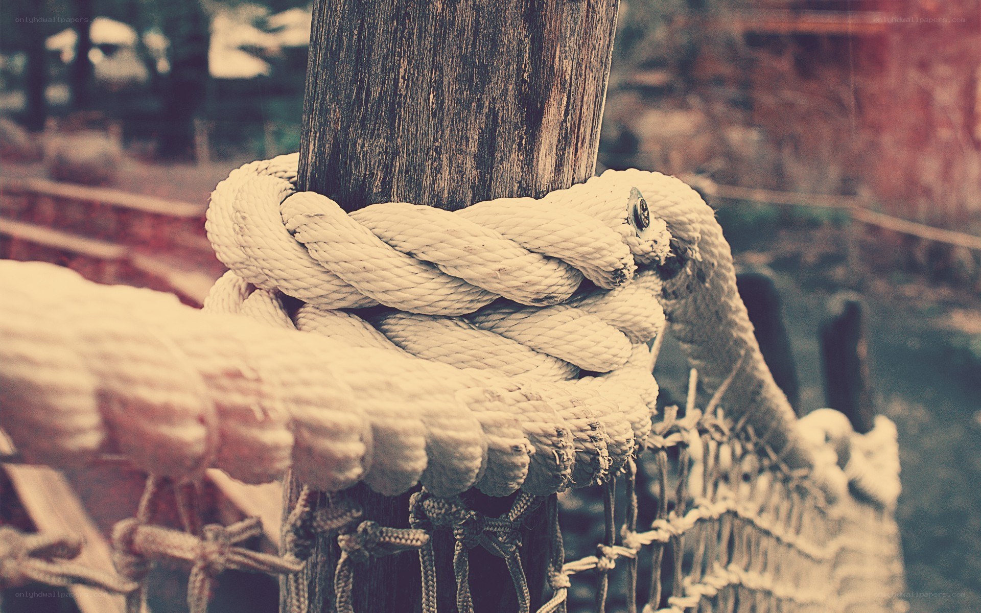 rope tied to wooden post